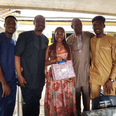 Benita Ojeriakhi receiving gifts from Ivorians